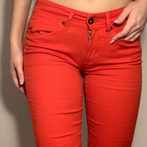Bright red orange Levi’s jeans